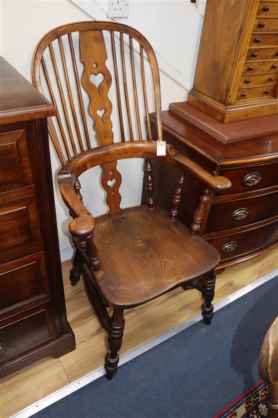 A harlequin set of six Victorian heart motif yew and elm Windsor chairs